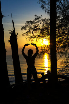 Woman with silhouette exercise and sunrise