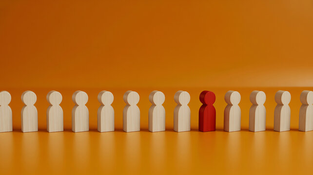 Unique red figure standing out in a row of white wooden people, leadership and individuality concept, diverse team on orange background