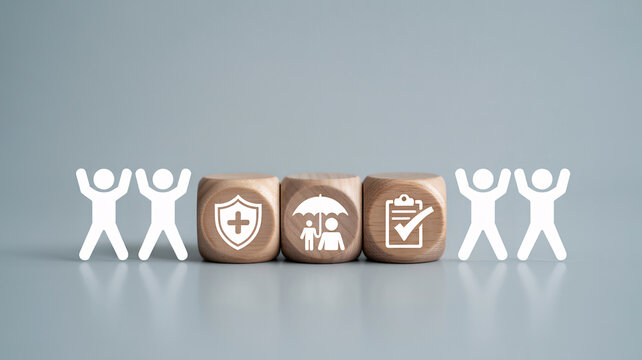 Insurance concept with wooden blocks and paper people. Health and life insurance icons on cubes. Protection and security symbols for family planning.