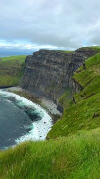 Scenic View of Cliffs of Moher and Ocean Waves Crashing on the Coast of Ireland