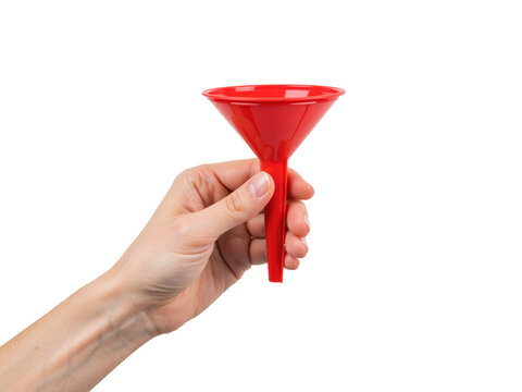 Hand holding a red plastic funnel by the stem, isolated on transparent background