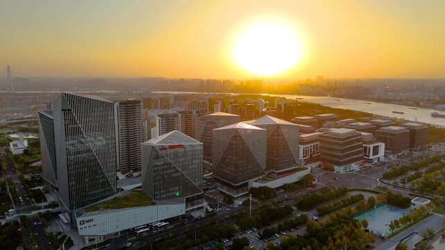 ** Sunset Skyline: Pyramid Skyscrapers River District in Guangzhou, China