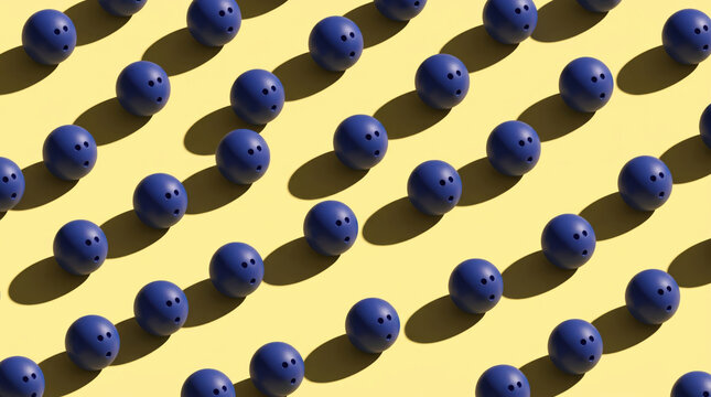 A repeating pattern of dark blue bowling balls arranged neatly on a vibrant yellow surface creating a symmetrical flat lay composition for sports design