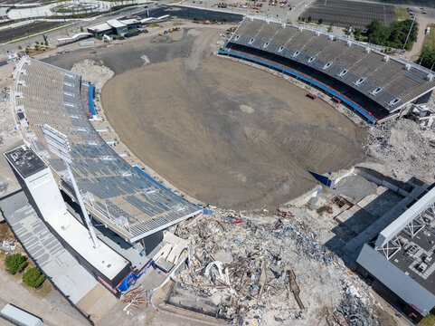 Orchard Park, United States - 19 July 2026: Aerial view of demolition of the former Buffalo Bills' Highmark Stadium, showing extensive debris, dismantled seating, and a turfless field.