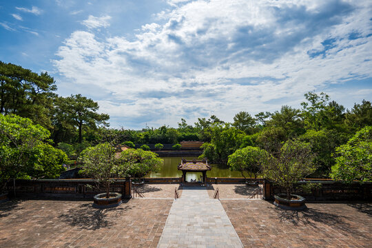 Mausoleum of Emperor Tu Duc garden area with lake, a historical landmark site in Hue, Vietnam.