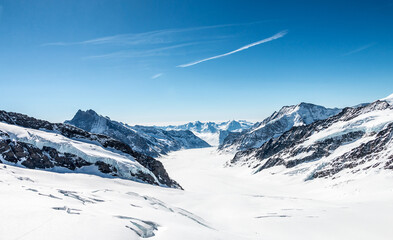 Obraz premium Landscape of Snow capped mountains at Jungfrau peaks. Top of europe at mount Alps, Switzerland.