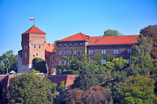 Wawel Royal Castle Complex with Thieves Tower and Polish Flag in Krakow Poland
