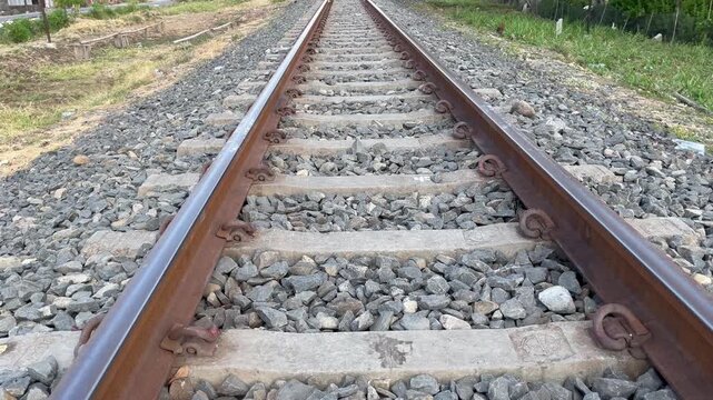 Cinematic Close Up of Steel Railway Lines and Gravel Ballast