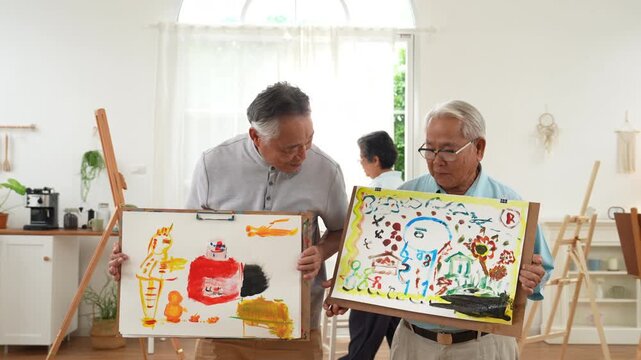 Elderly men enjoying an art therapy session, proudly presenting colorful paintings in a bright studio, promoting senior wellness, cognitive stimulation, emotional expression, and active aging.