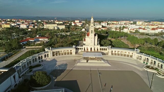 Aerial view of the Sanctuary of Fatima with its iconic basilica and large square surrounded by colonnades in Fatima, Santarem District, Portugal.