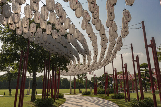 Wide View of Japanese Style Lantern Canopy and Red Pillars in Park