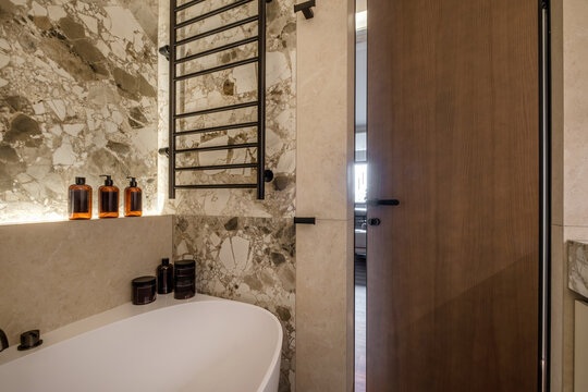  details of corner with water tap sink with faucet with soap and shampoo dispensers in expensive bathroom in rustic eco style