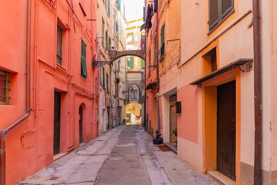 Cozy narrow street with drying laundry in Liguria district, Sanremo, Italy