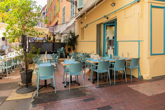 Nice, France, 25 August 2026: Cozy outdoor restaurant in Old town of Nice