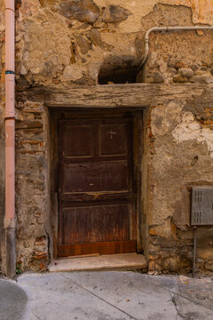 Wooden door in stone wall