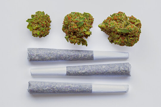 Marijuana Joints and Cannabis Buds on White Background