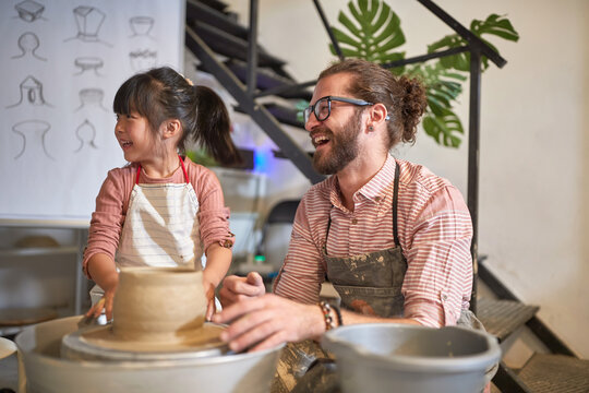Girl student and teacher on pottery workshop. Creative, hobby ,workshop  concept