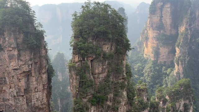 Scenic sandstone pillars at Zhangjiajie National Forest Park in China attract nature lovers and photographers