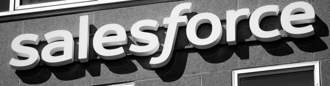 Stockholm, Sweden - 2026.07.31: The logotype of Salesforce, an American cloud-based software company, attached to a building facade in Stockholm city center. Captured in black and white.  