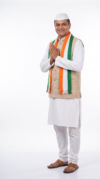 Indian Poltician in Traditional Kurta with Tricolor Scarf in Namaste Pose