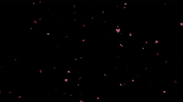  falling love hearts of romantic love themed sweetheart shapes tumbling out of the sky in a shower of many little small red and pink hearts dropping from above with plain black background 4K