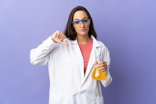 Young scientific woman over isolated background showing thumb down with negative expression