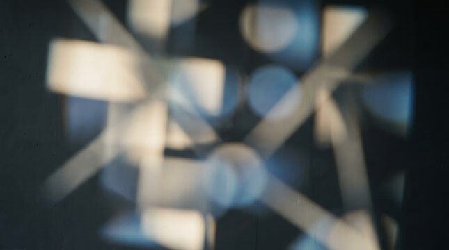 Dynamic motion blur of light shapes on a dark surface