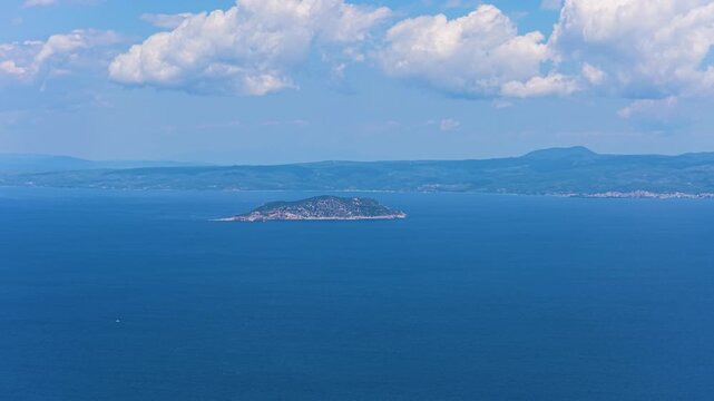 Kelifos Island surrounded by deep blue Aegean Sea