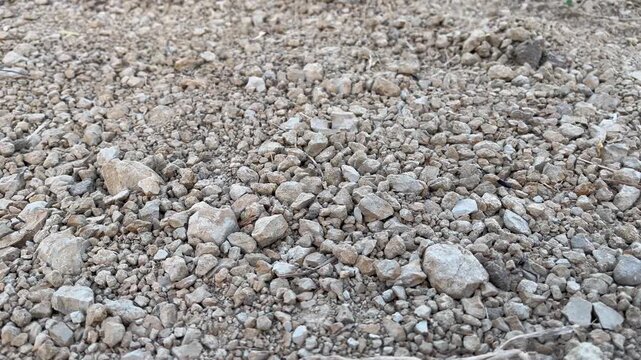 Rough mixture of crushed stones gravel and dirt for construction material