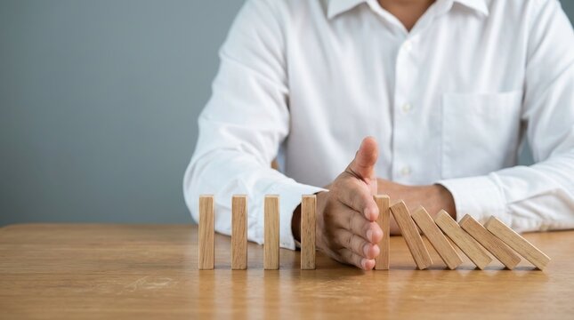 Risk prevention, crisis control, domino effect and business stability concept.