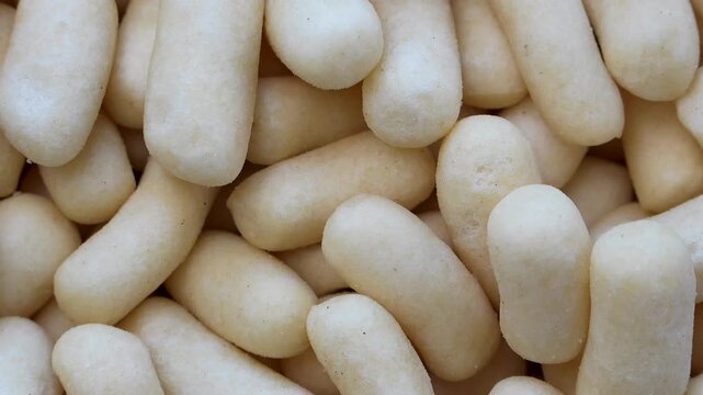 Rotating closeup of traditional Indonesian fish cracker snacks