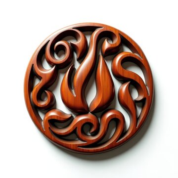 Maori carved wooden fire talisman with swirling koru flame designs on white background, traditional new zealand art symbol