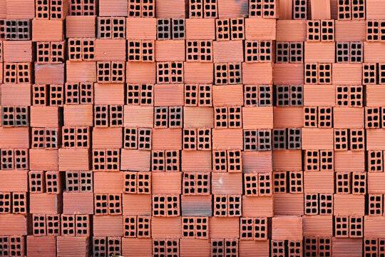 Stack of Red Clay Bricks Pattern with Holes
