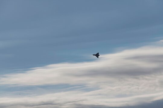 Eurofighter typhoon fighter plane during an exercise flight in the morning cloud sky of Austria