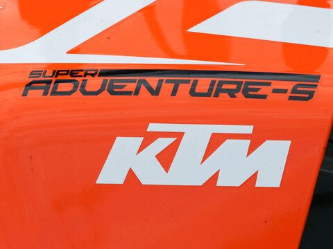Germany, Paderborn, September 05. 2026,  KTM logo and Super Adventure S decal on an orange motorcycle fairing