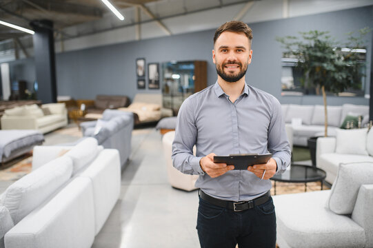 Sales consultant working in modern furniture store showroom