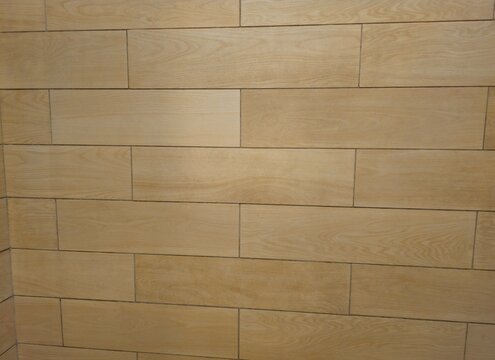 old paper textureWarm wooden panels arranged neatly in staggered rows. Subtle grain patterns echo natural textures across each plank. Light beige tones reflect calm, minimalist aesthetics. 