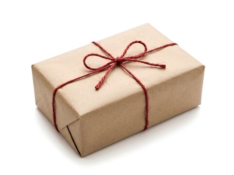 Gift box wrapped in brown paper with red twine isolated on white background