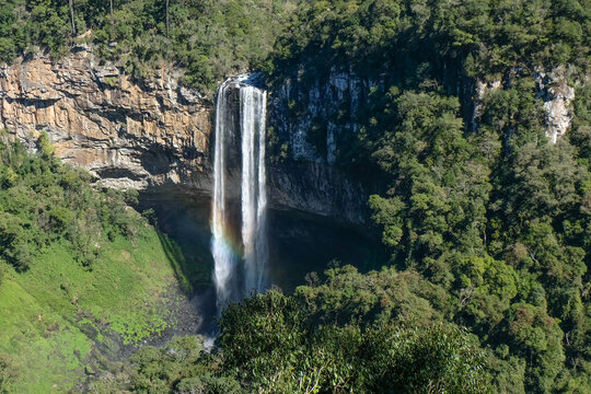 Canela - Caracol Falls waterfall with rainbow cascading over cliff, Rio Grande do Sul in Brazil