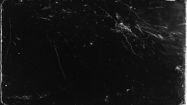 Abstract black grunge scratched surface with distressed paint, cracks and dirty paper wall aesthetic, moody aged industrial background. Old Film Dust and Scratches with Vintage Grain and Grunge
