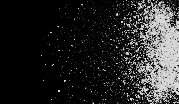 White powder or flour explosion isolated on black background, abstract dust particles cloud splash