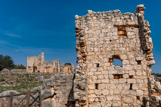 Ancient stone fortress ruins. Sunlight illuminates the weathered stone walls of an ancient archaeological fortress. Evoking a sense of history and timeless adventure.