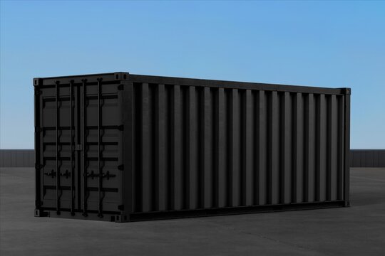 Black shipping container on industrial concrete yard