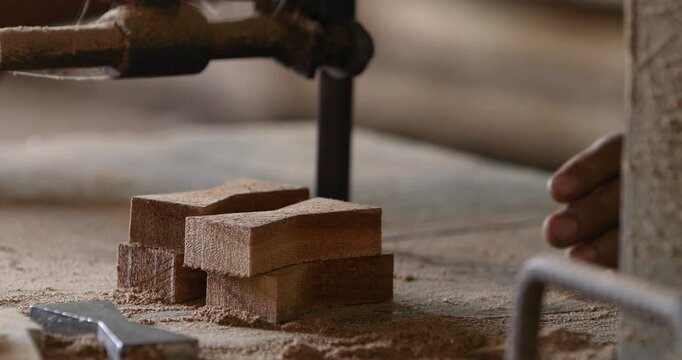 Skilled carpenter working with hand tools to shape and cut wood in a workshop, highlighting traditional craftsmanship, woodworking, furniture making and manual labor.