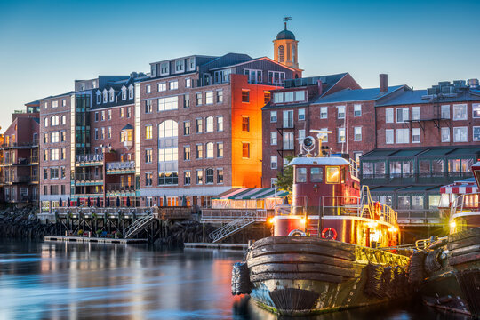 Portsmouth, New Hampshire, USA town cityscape with tugboats