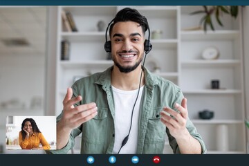 Smiling Young Man With Beard And Headset Engaging In Video Call, Communicating Effectively From...
