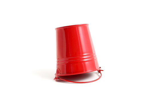 There is a red bucket on a white background.
