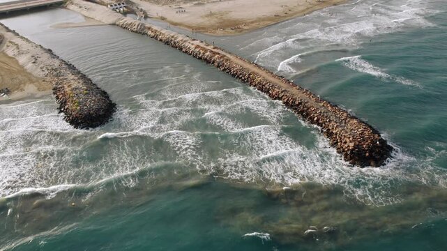 Aerial View of Rock Breakwater at Ocean Beach Coast