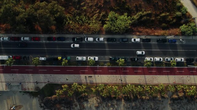 Overhead Drone View of Traffic on Coastal Road