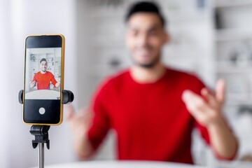Happy Young Male, Asian, Recording Video Message With Smartphone At Home While Sitting At Desk....